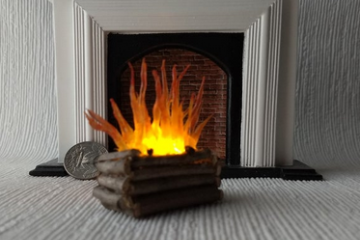 Flickering lit logs insert for your fireplace (1:12)
