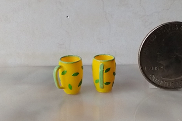 1:12 Dollhouse miniature yellow mug with random green leaves PRICE is for ONE REF Green leaves