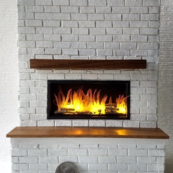 My first white brick wall fireplace with lit insert