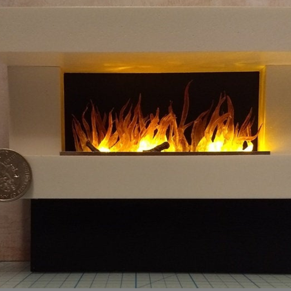 Wall mounted white fireplace with flickering insert