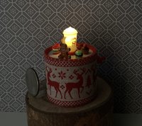 Miniature merry go round hand crank automaton with ligt up cream lidded mug and a parade of gingerbread people, ribbon candy, cupcake and French macarons