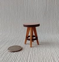 1:12 Dollhouse bath stool with pink laminate seat and solid cherry legs