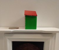 1:12 Dollhouse light up advent calendar with JOY sign above the twenty-four openable drawers Battery operated miniature holiday LEDs decor No external wires