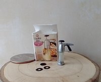 1:12 Dollhouse miniature cookie press and discs set in packaging box with clear front window Boxed spritz cookie press Price is for EACH set