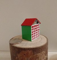 1:12 Dollhouse light up advent calendar with JOY sign above the twenty-four openable drawers Battery operated miniature holiday LEDs decor No external wires