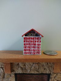 1:12 Dollhouse light up advent calendar with JOY sign above the twenty-four openable drawers Battery operated miniature holiday LEDs decor No external wires