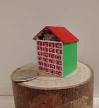 1:12 Dollhouse light up advent calendar with JOY sign above the twenty-four openable drawers Battery operated miniature holiday LEDs decor No external wires