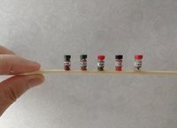 1:12 dollhouse miniature set of five spice jars in frosted acrylic rack REF 1 black lid