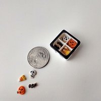 1:12 scale miniature gift boxed Halloween cookies 16 assorted pumpkins skulls candy corn and bats in box with dividers and clear window REF White base