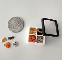 1:12 scale miniature gift boxed Halloween cookies 16 assorted pumpkins skulls candy corn and bats in box with dividers and clear window REF White base
