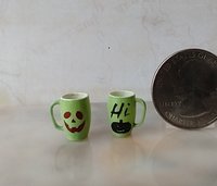 1:12 Dollhouse miniature green mug with Jack O lantern face and "Hi" pumpkin Halloween mug PRICE is for ONE REF Green Hi