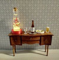 Dollhouse miniature battery lighted glass bottle red glitter glow-in-the-dark cutouts and abstract JOY ornament inside bottle for 12th or play scale dioramas No external wires