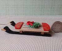 1:12 scale dollhouse wooden sled made from solid hard maple with green wreath and Happy Holidays sign REF Non-lit wreath