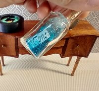 Dollhouse miniature battery lighted glass bottle blue glitter bubbles and "Time" tag inside bottle for 12th or play scale dioramas No external wires