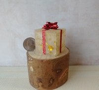 Miniature light up gift box in golden flakes with a  red gift bow Battery lighted festive gift box for mini holiday scene display REF Golden flakes red bow