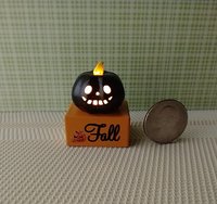 Battery lighted miniature Jack-o-Lantern Pumpkin light on black stand Halloween light for 1-inch scale or play scale REF Black pumpkin