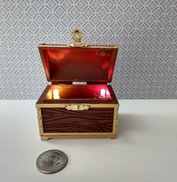 1:12 scale miniature battery lighted treasure chest in chocolate color wood grain texture lights up when lid is open