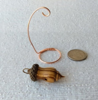 Miniature lathe turned zebrawood bird house with acorn cap on copper wire stand