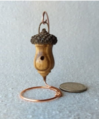 Miniature lathe turned zebrawood bird house with acorn cap on copper wire stand