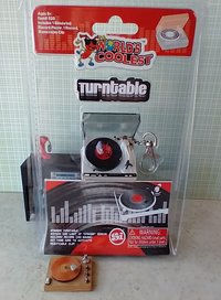 Miniature turntable keychain with motion and light - it spins and  lights up