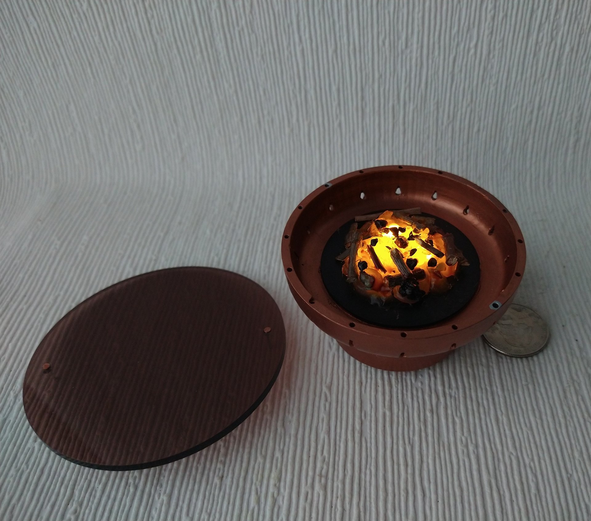 1:12 Dollhouse miniature fire pit Battery operated firepit in copper tone with flickering embers and wood sticks Dual function firepit/ patio coffee table