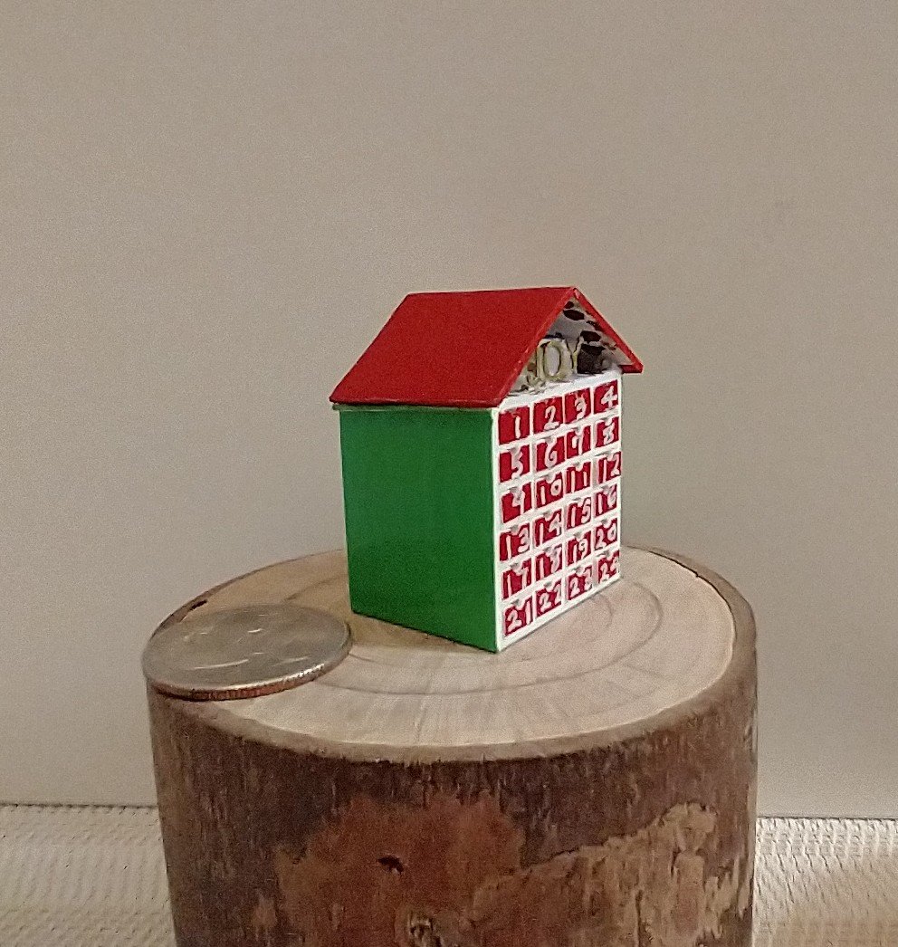 1:12 Dollhouse light up advent calendar with JOY sign above the twenty-four openable drawers Battery operated miniature holiday LEDs decor No external wires