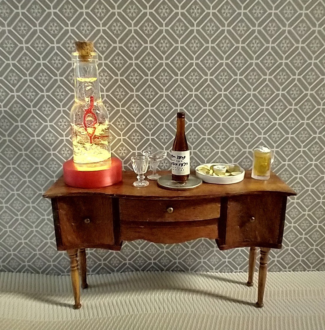 Dollhouse miniature battery lighted glass bottle red glitter glow-in-the-dark cutouts and abstract JOY ornament inside bottle for 12th or play scale dioramas No external wires