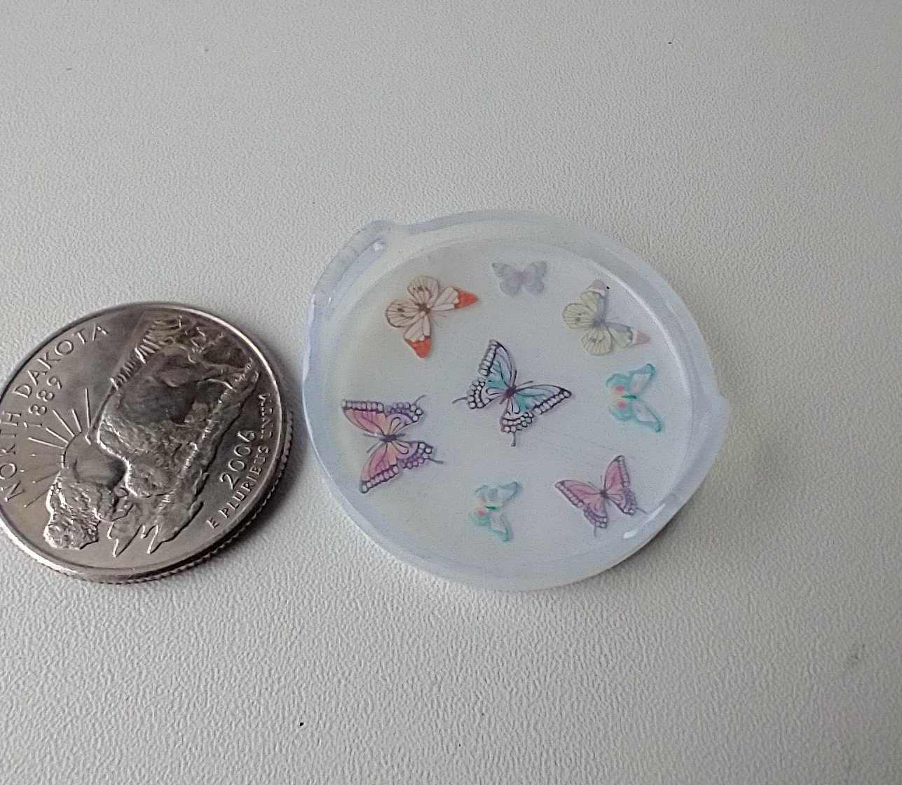 1:12 scale round serving tray faux acrylic tray with butterflies on white background