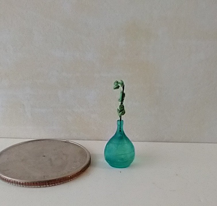 1:12 miniature tear drop shaped flower vase in transparent blue comes with green plant