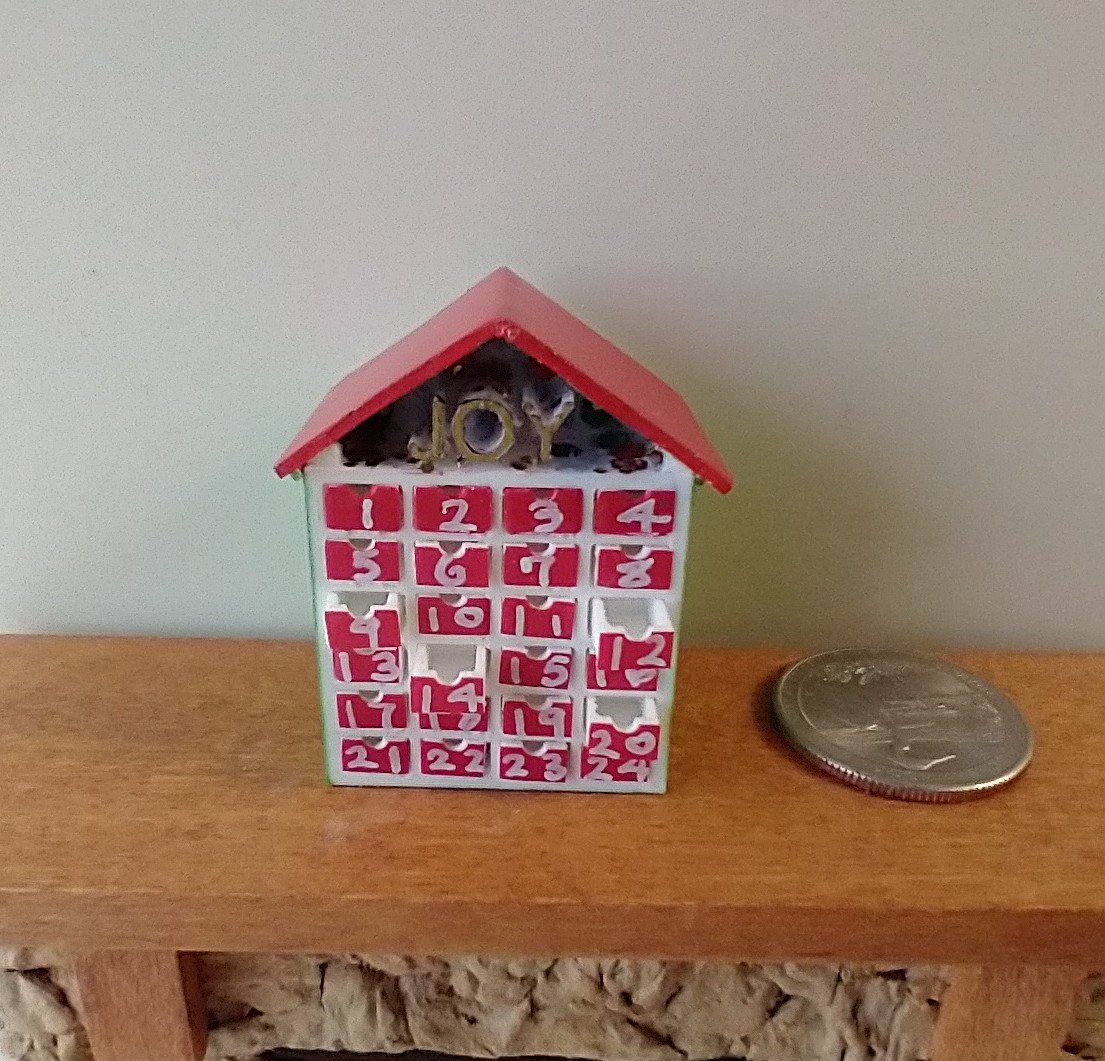 1:12 Dollhouse light up advent calendar with JOY sign above the twenty-four openable drawers Battery operated miniature holiday LEDs decor No external wires