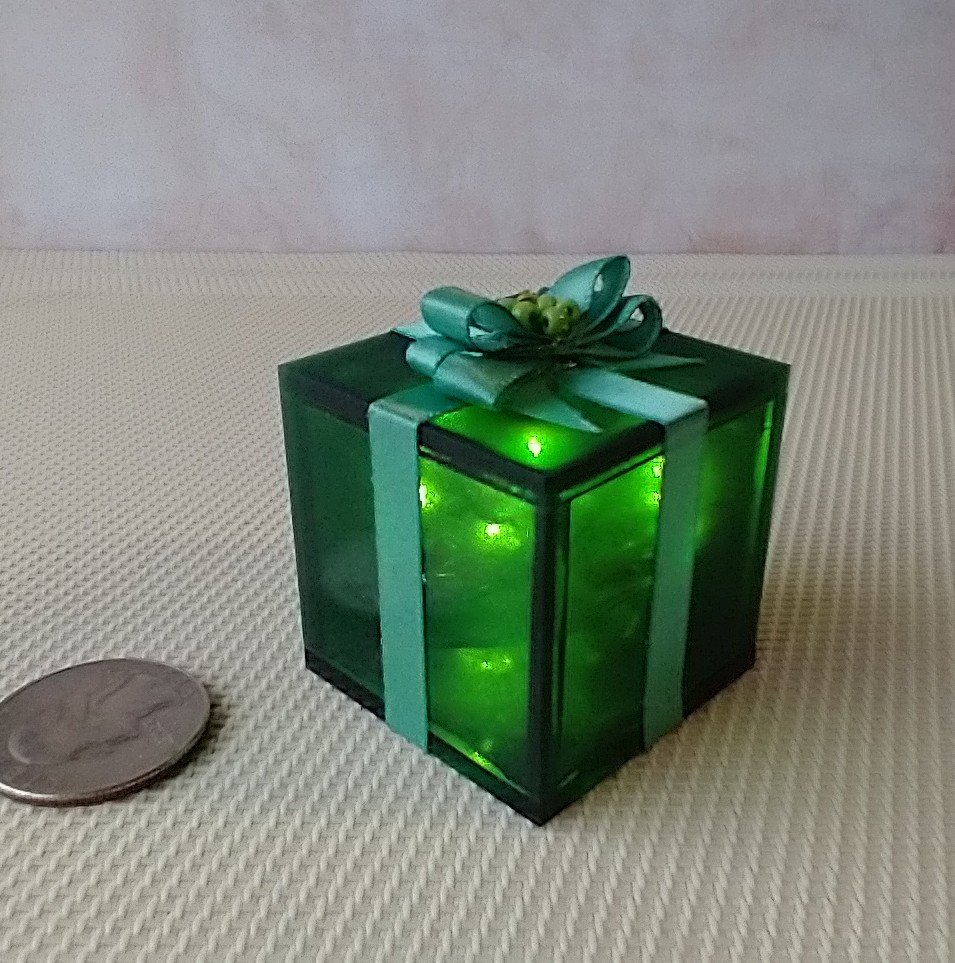Miniature light up gift box in green with a light green gift bow Battery lighted festive gift box for mini holiday scene display REF Green