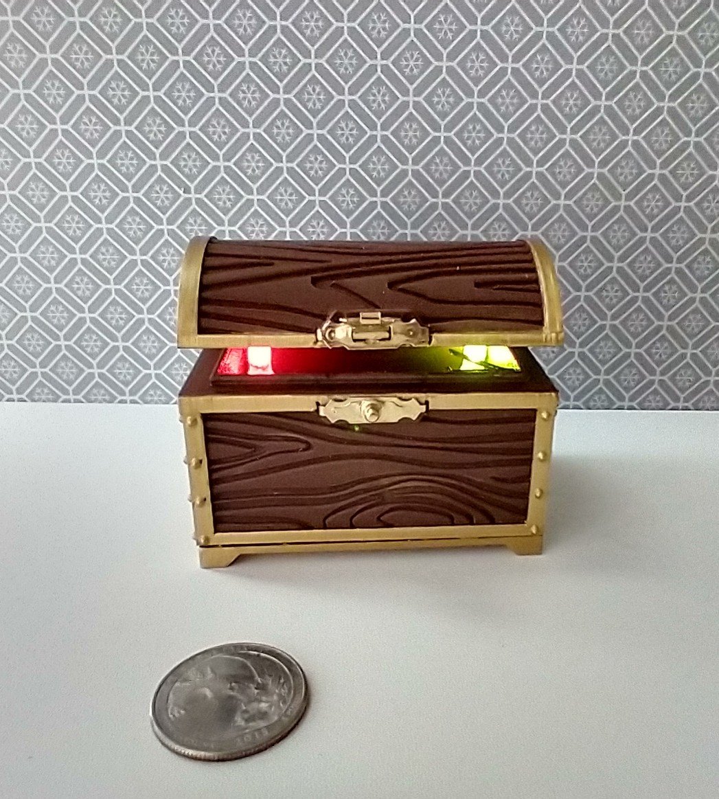 1:12 scale miniature battery lighted treasure chest in chocolate color wood grain texture lights up when lid is open
