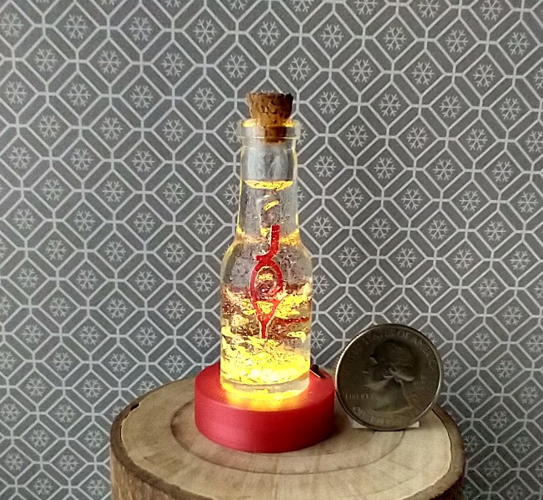 Dollhouse miniature battery lighted glass bottle red glitter glow-in-the-dark cutouts and abstract JOY ornament inside bottle for 12th or play scale dioramas No external wires