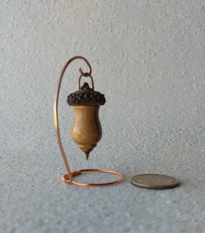 Miniature lathe turned zebrawood bird house with acorn cap on copper wire stand
