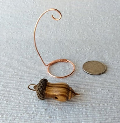 Miniature lathe turned zebrawood bird house with acorn cap on copper wire stand
