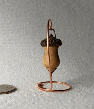 Miniature lathe turned zebrawood bird house with acorn cap on copper wire stand