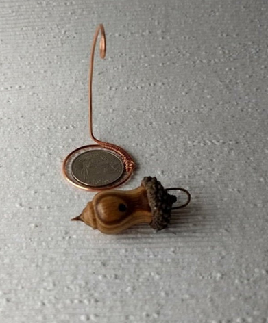 Miniature lathe turned zebrawood bird house with acorn cap on copper wire stand