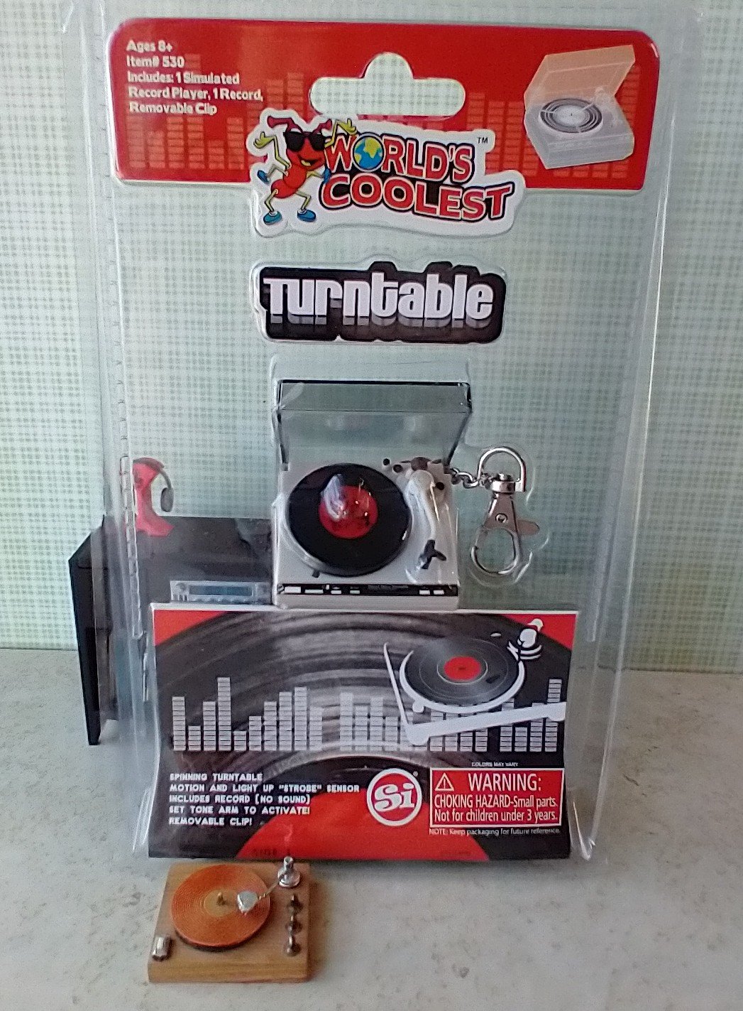 Miniature turntable keychain with motion and light - it spins and  lights up
