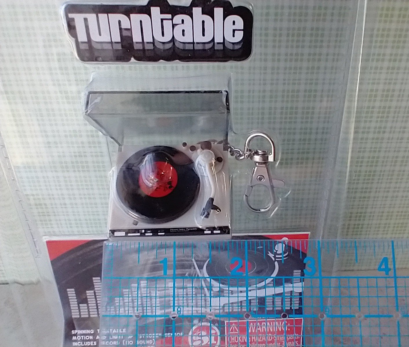 Miniature turntable keychain with motion and light - it spins and  lights up
