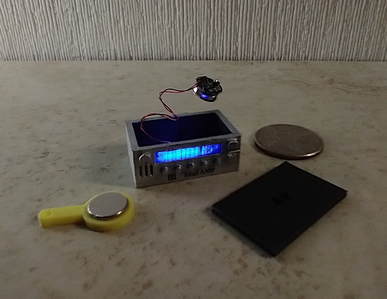 1:12 scale dollhouse audio amplifier with battery operated blue LED light