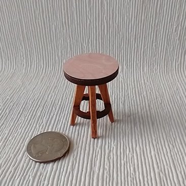 1:12 Dollhouse bath stool with pink laminate seat and solid cherry legs