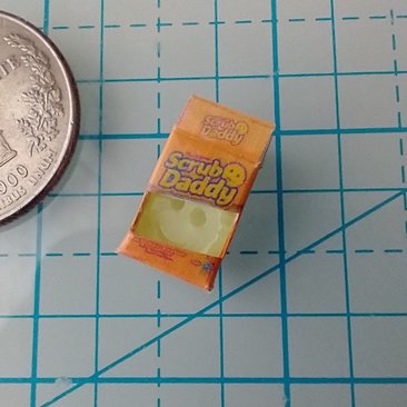 1:12 Dollhouse kitchen sponge in open packaging box