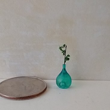 1:12 miniature tear drop shaped flower vase in transparent blue comes with green plant